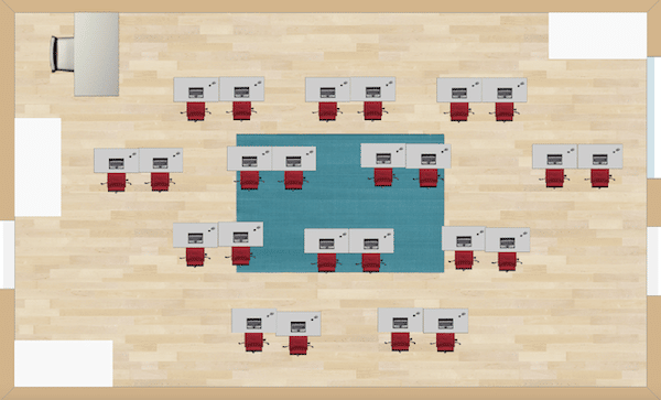 Pairs of desks are arranged resembling rows and columns. The desks are staggered so that all students have equal access to view the teacher or board up front.